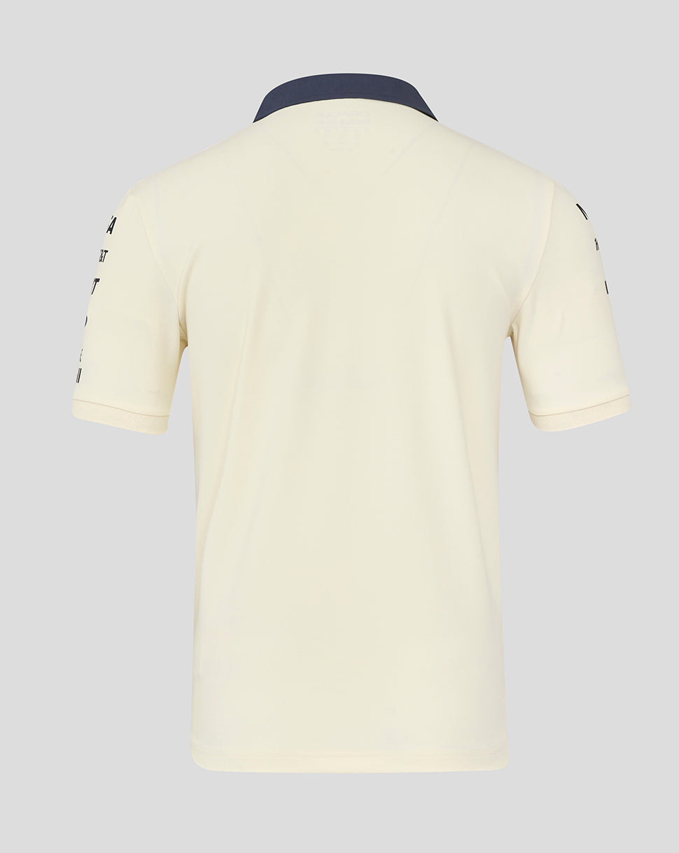 Back view of egret heritage polo shirt showing navy collar and clean cream back