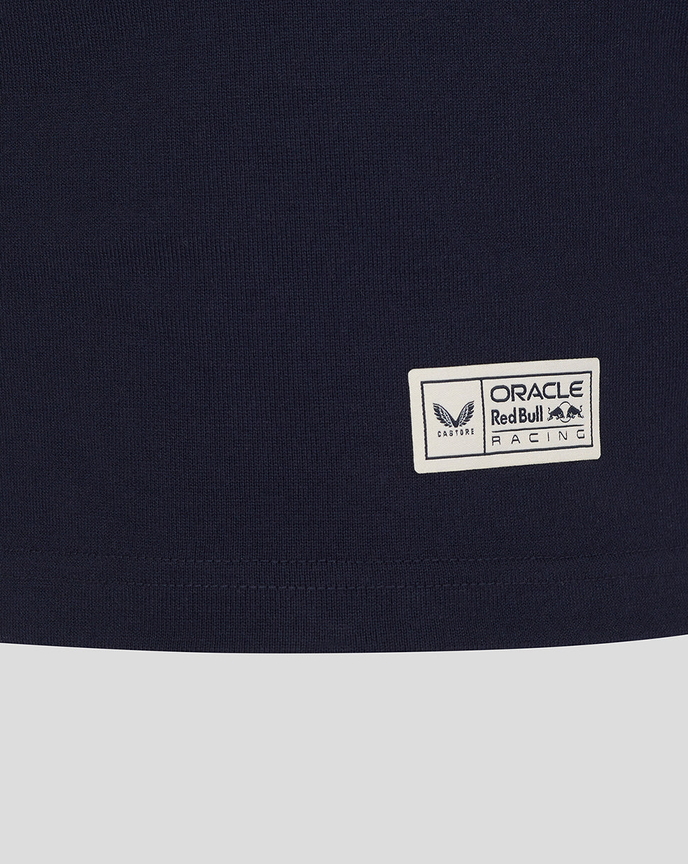 Close-up of small rectangular Oracle Red Bull Racing patch on navy fabric near the hem