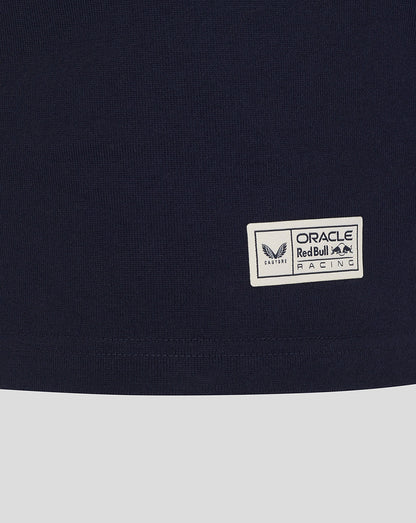 Close-up of small rectangular Oracle Red Bull Racing patch on navy fabric near the hem