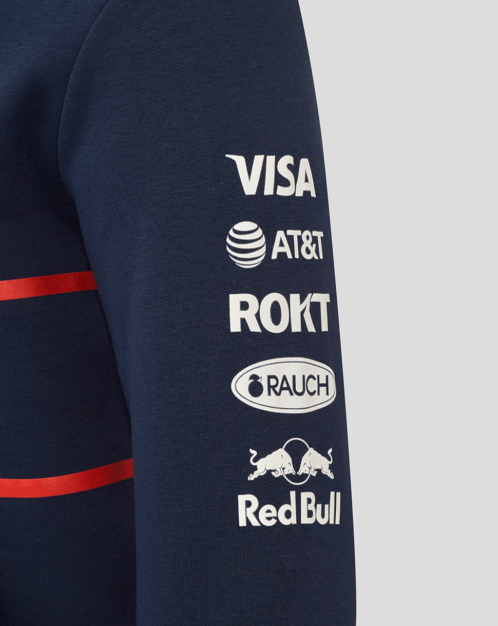 Navy hoodie sleeve with white sponsor logos including Visa AT&T ROKT Rauch and Red Bull.