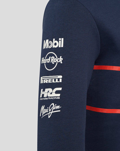 Navy hoodie sleeve with vertical white sponsor logos Mobil 1 Hard Rock Pirelli HRC Maui Jim and a red chest stripe