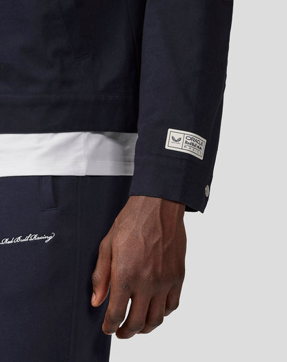 Navy Oracle Red Bull Racing work jacket sleeve with branded patch at the cuff and metal snap detail