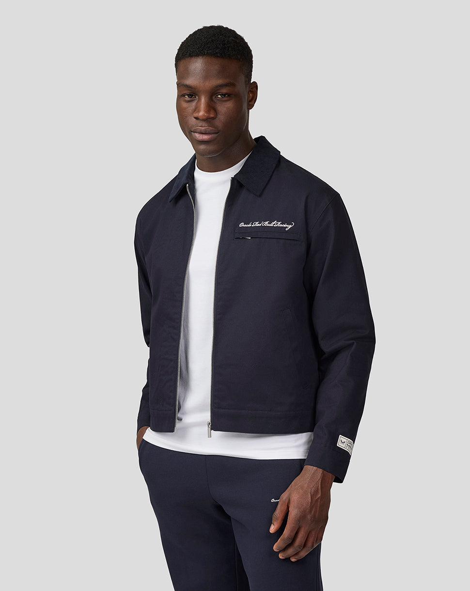 Navy unisex heritage work jacket worn by model with zip front and corduroy collar