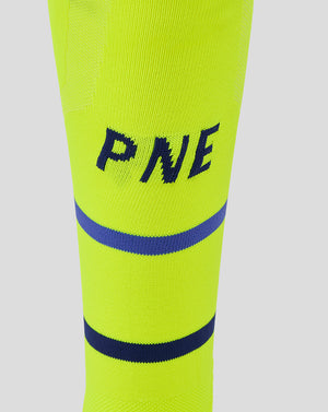 Close up of neon yellow Preston Junior 25/26 Third Sock showing PNE lettering and blue stripes.