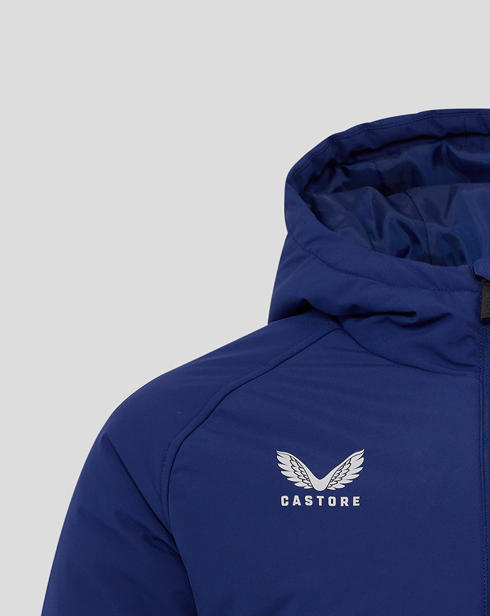 Close up of blue padded jacket showing the hood and chest area with Castore logo and club crest.