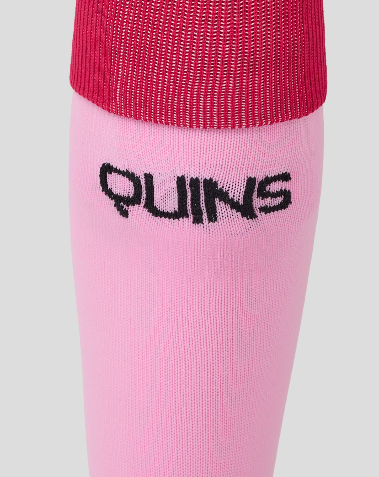 Pink Harlequins away sock with black script Quins logo on the lower leg.