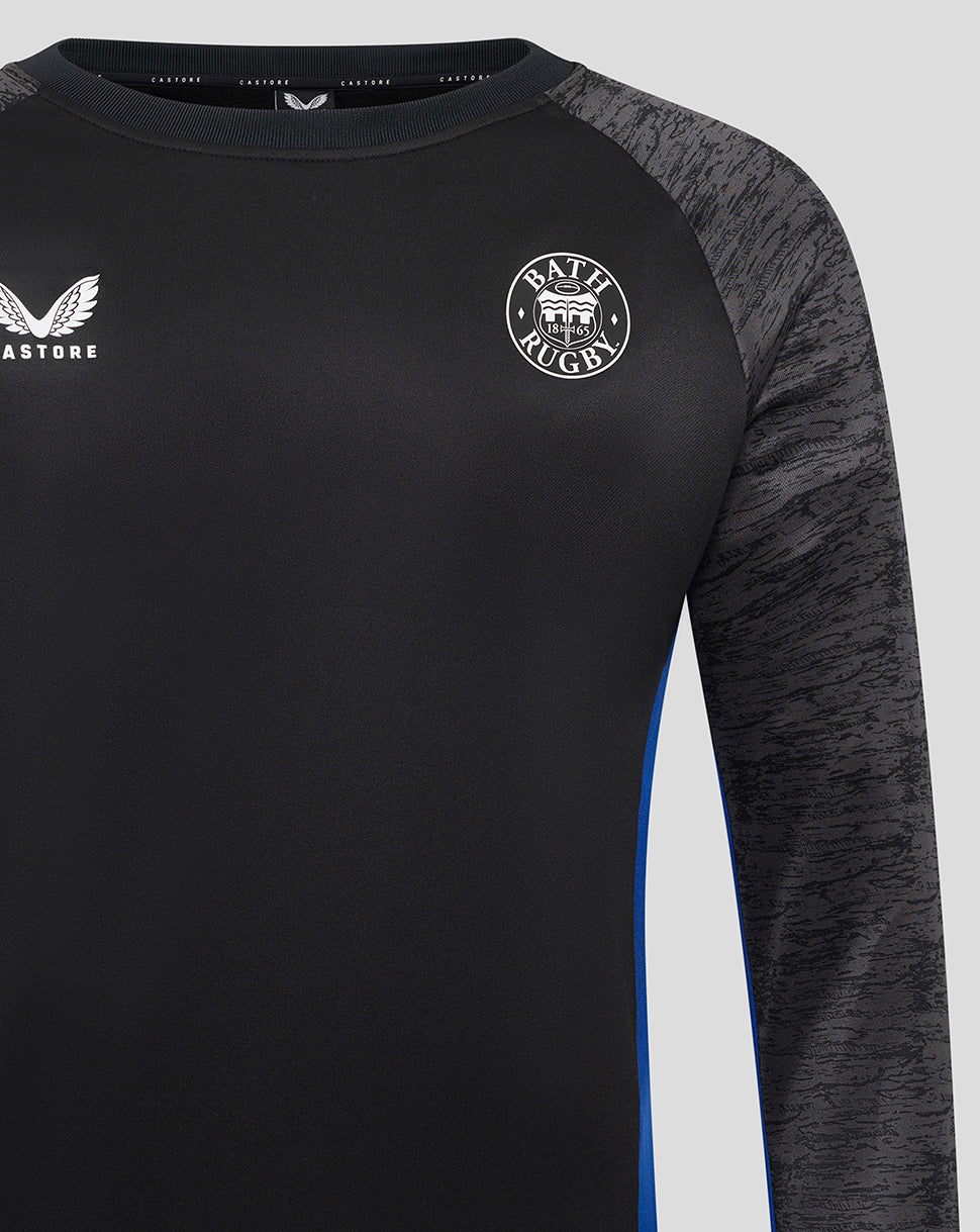 Close up of Bath Rugby sweatshirt chest area showing Castore logo on left and Bath Rugby crest on right.