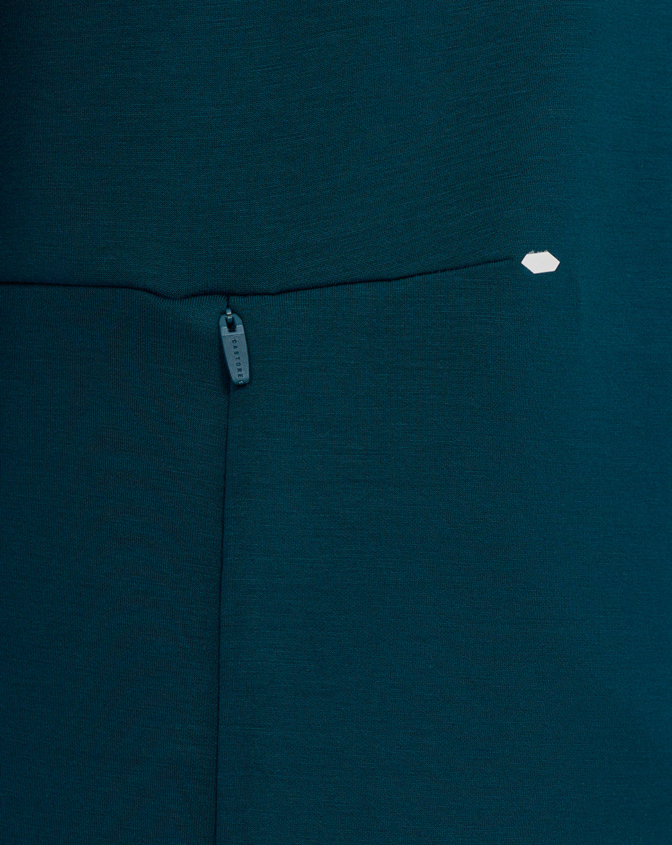 Close-up of Reflecting Pond teal England Rugby Travel Crew Sweatshirt showing a zip pocket and Castore branding