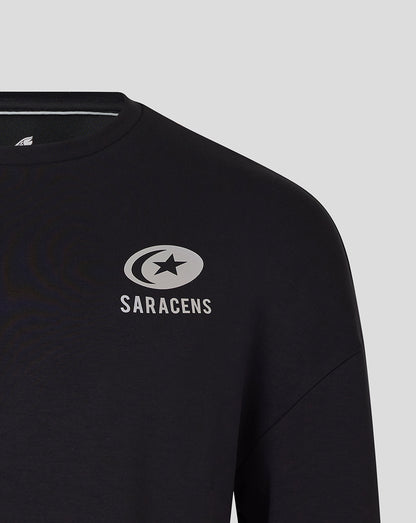 Close-up of Saracens logo on chest of black sweatshirt.