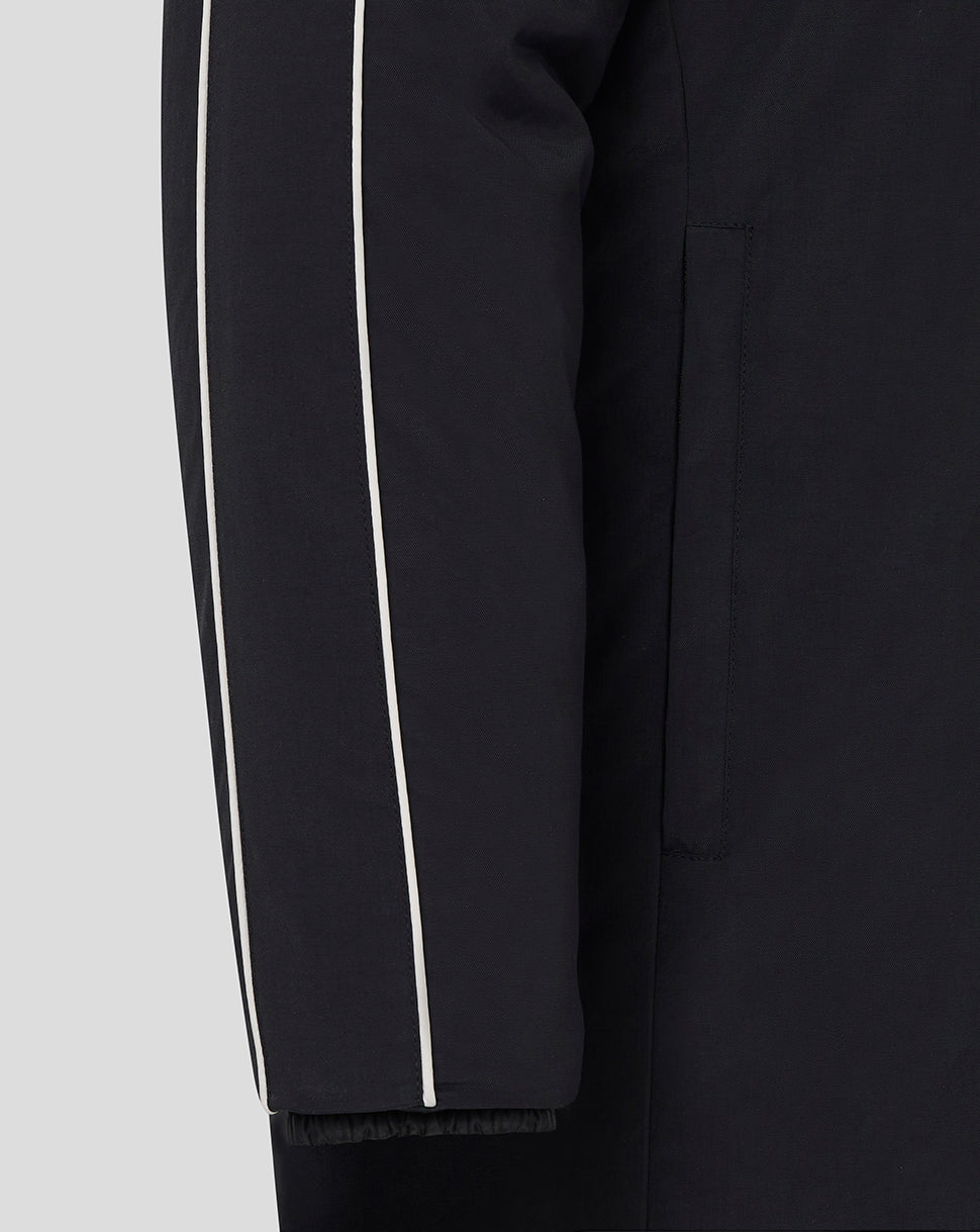Sleeve detail of Rangers Travel Bench Jacket Caviar with white piping along the arm.