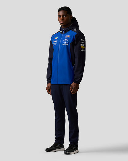 Male model wearing Oracle Red Bull Racing Teamline water resistant jacket in Night Sky with hood and sponsor logos.