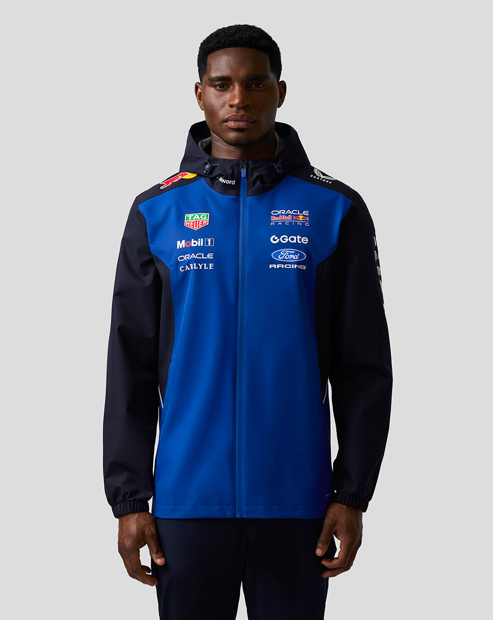 Male model wearing Oracle Red Bull Racing Teamline water resistant jacket in Night Sky with hood and chest branding.