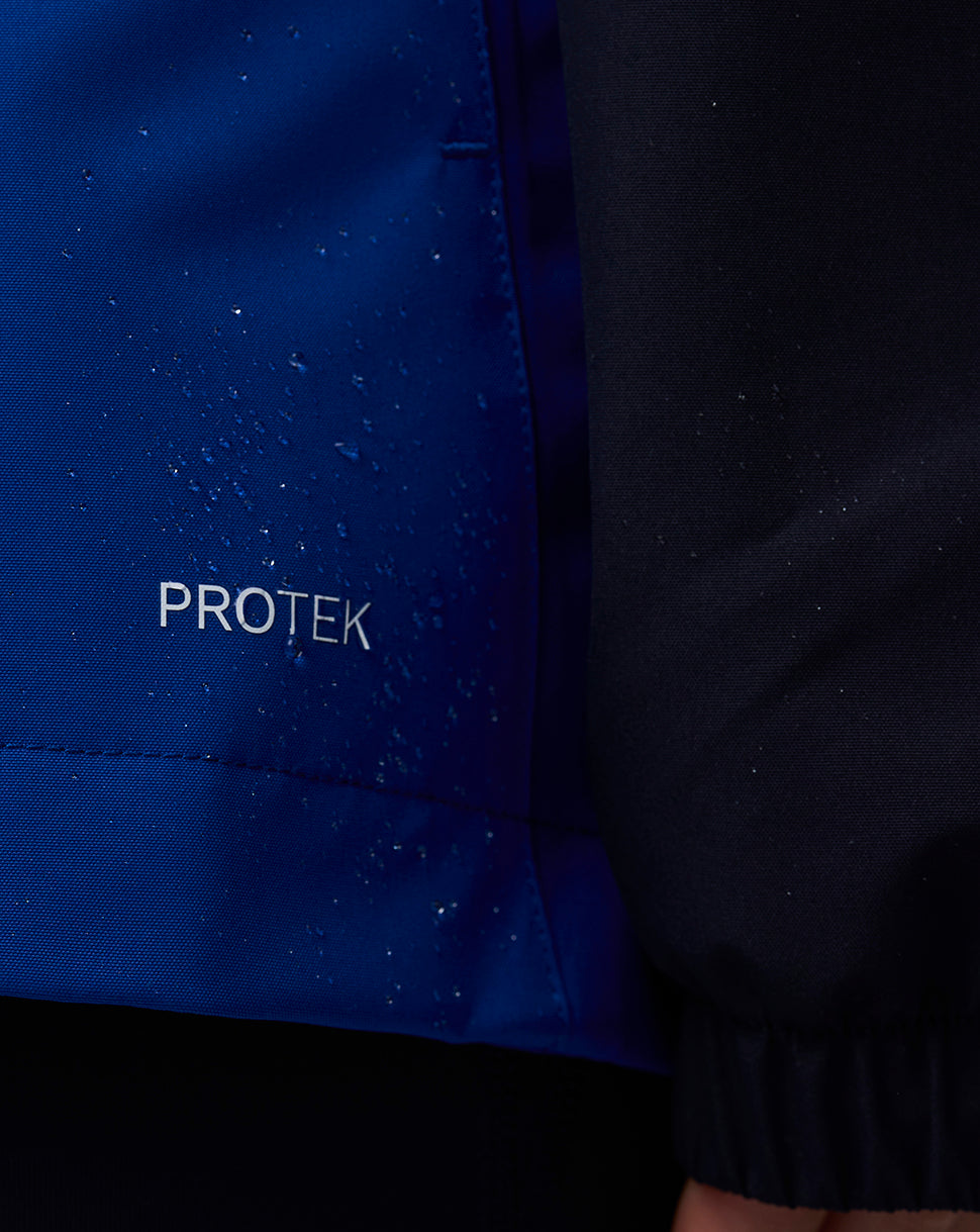 Close up of blue ProTek jacket fabric with water droplets and PROTEK lettering