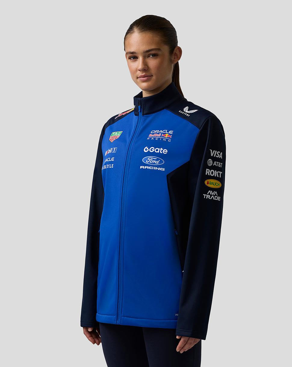 Female model wearing Oracle Red Bull Racing Teamline Soft Shell Jacket in night sky blue with navy sleeves