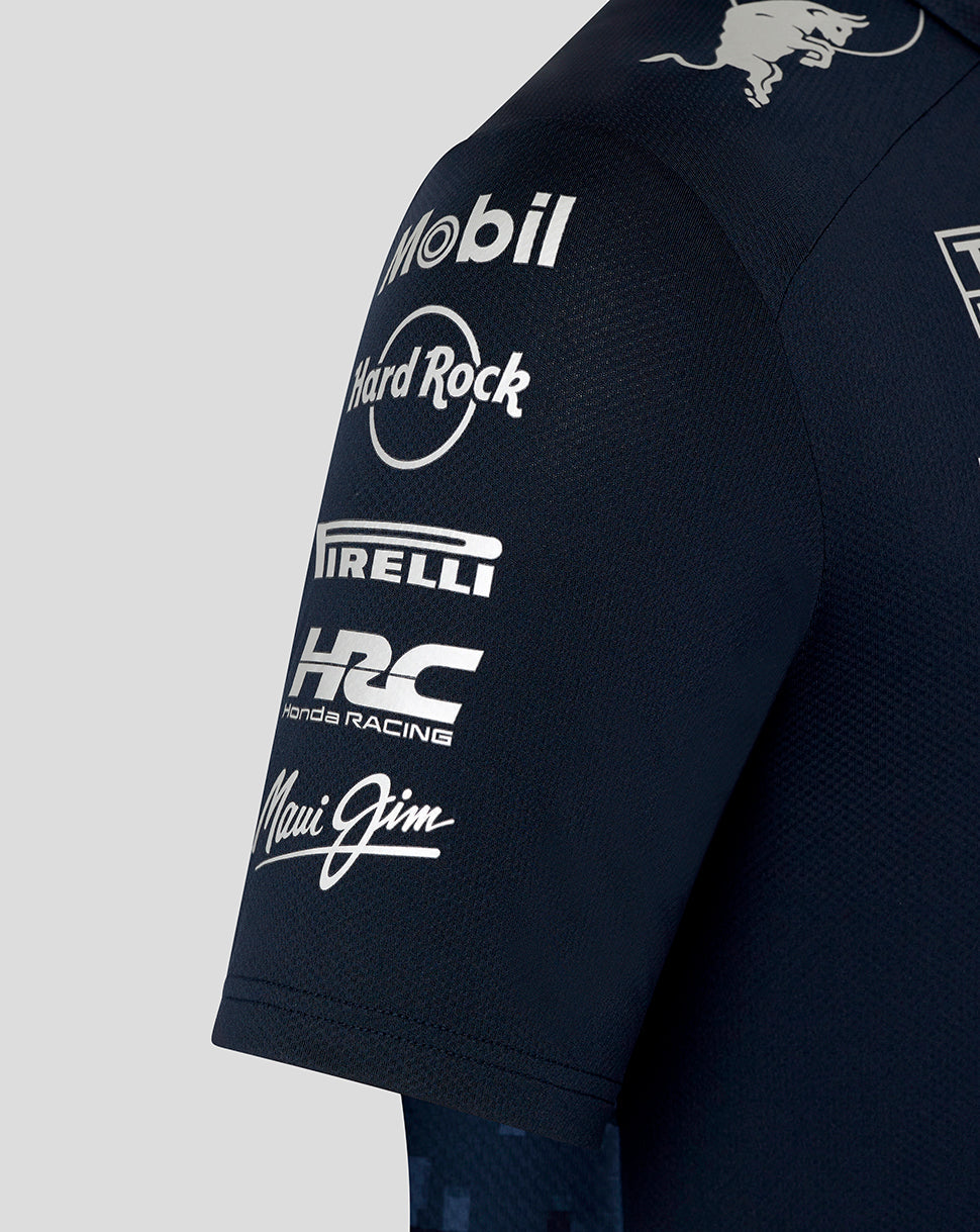 Shoulder view of the navy track polo displaying Mobil Hard Rock Pirelli HRC Honda Racing and Maui Jim logos.