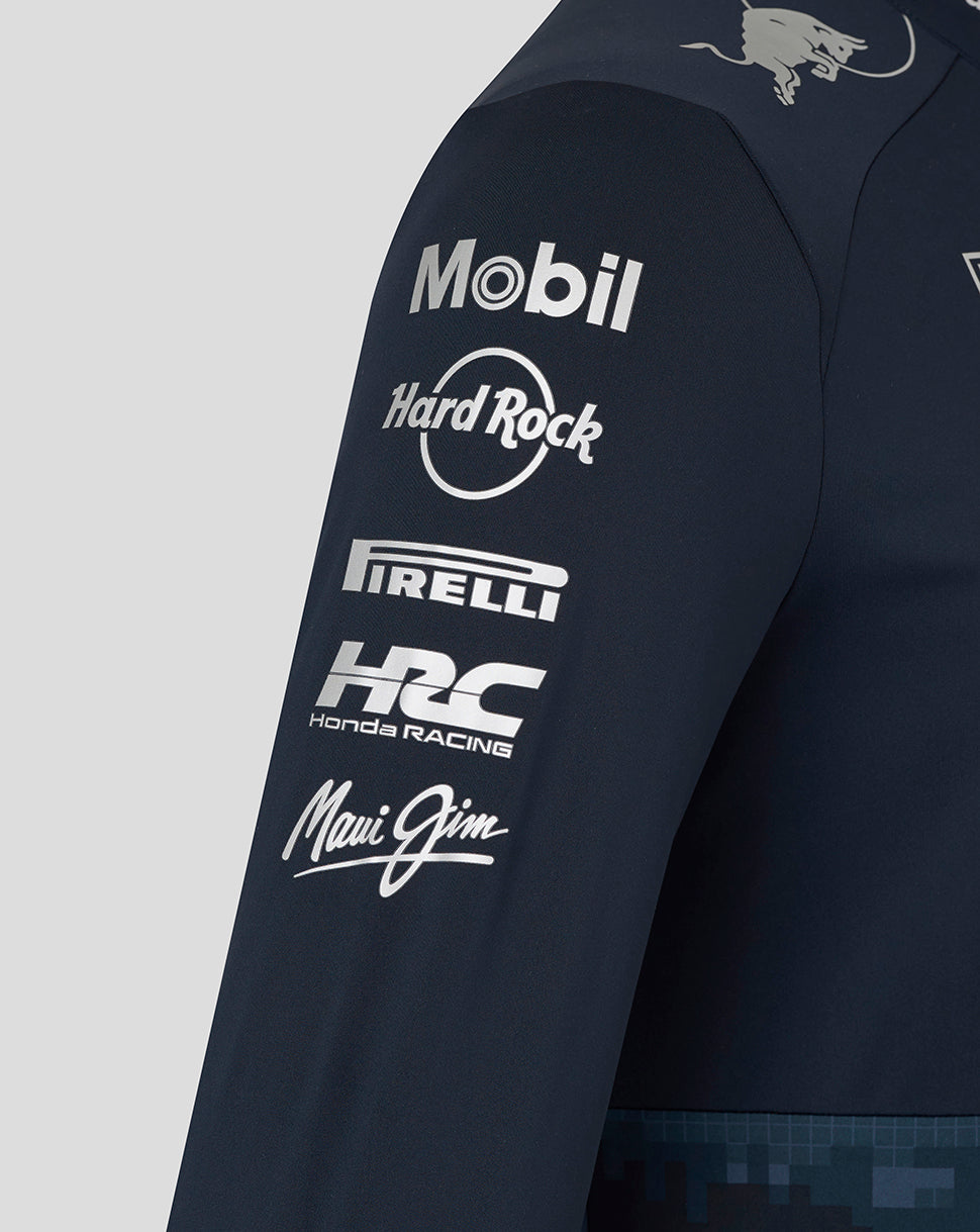 Side view of the navy team jacket sleeve with Mobil Hard Rock Pirelli Honda Racing and Maui Jim logos and Red Bull crest