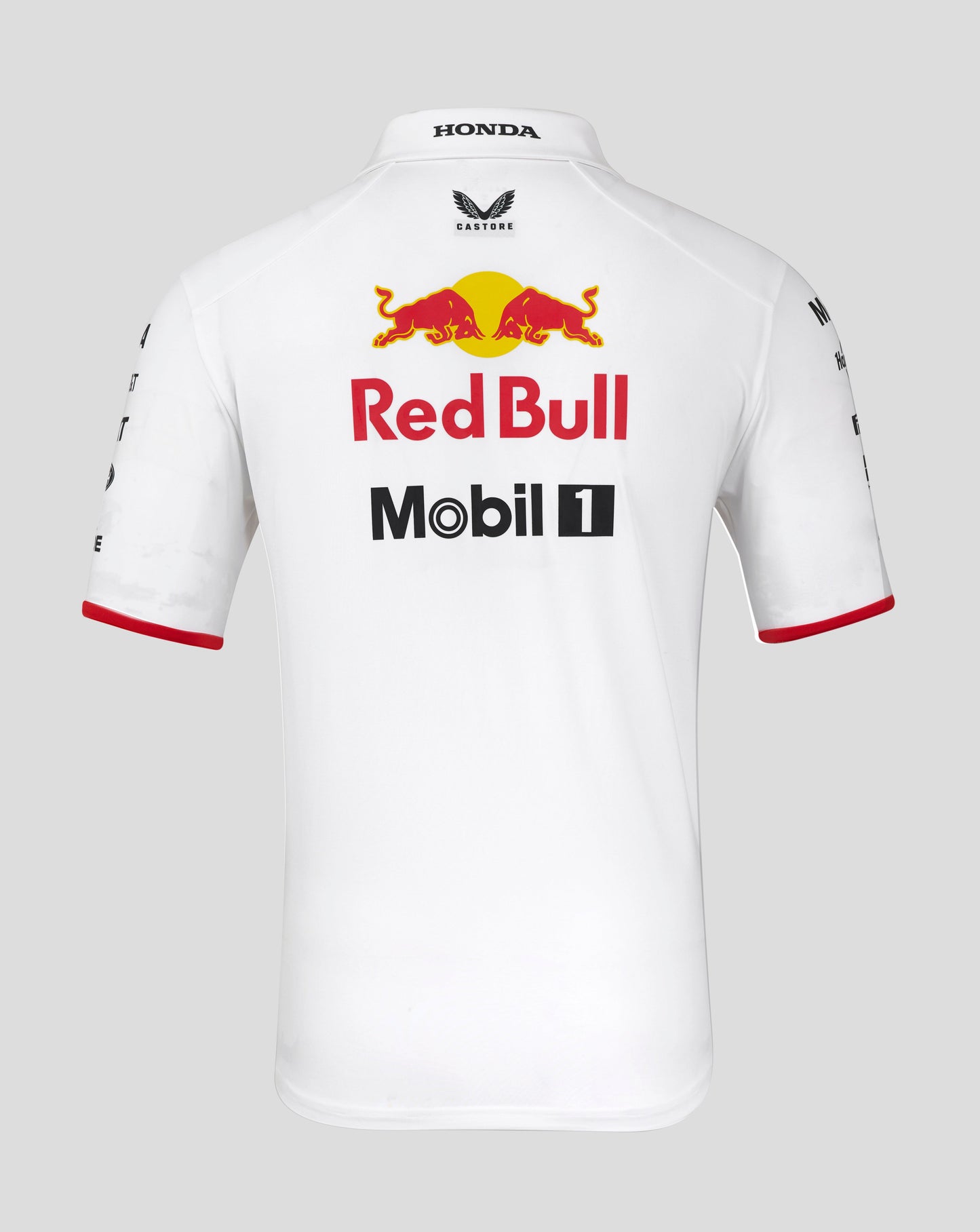 Back view of white Red Bull Racing polo featuring large Red Bull graphic and Mobil 1 branding.
