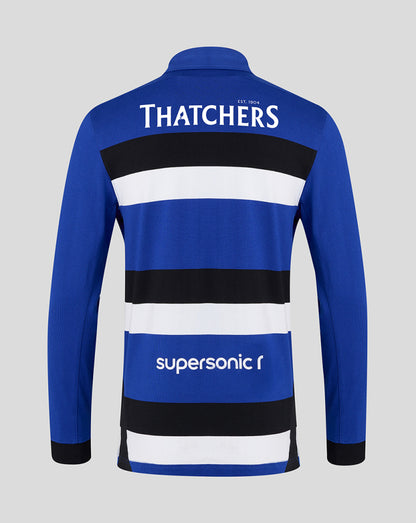 Back view of Bath Rugby Home Shirt in blue with white and black horizontal stripes and Thatchers logo