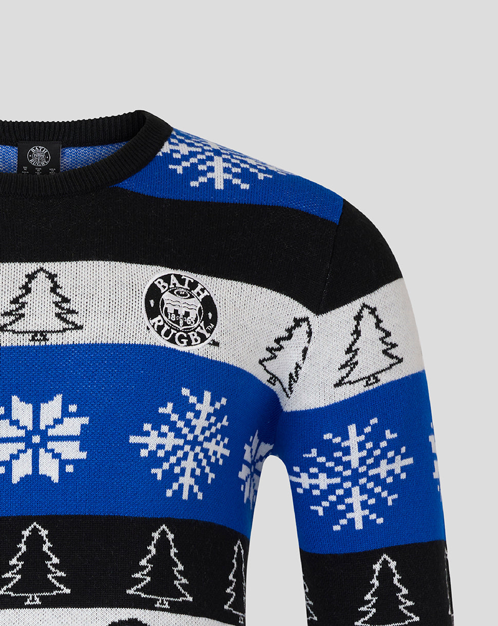 Close up of Bath Rugby Christmas jumper featuring blue black white stripes with snowflakes trees and Bath Rugby badge