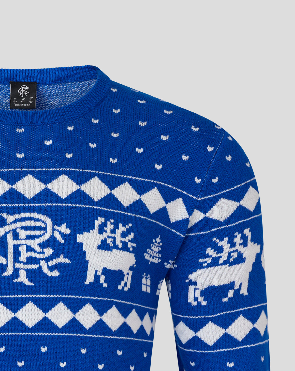 Front close up of blue Christmas jumper showing white reindeer and geometric pattern