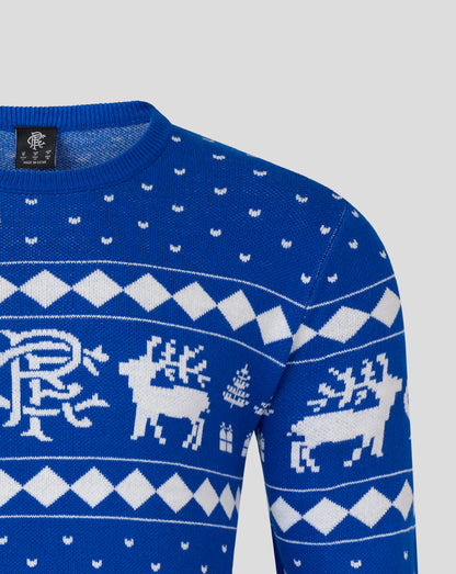 Front close up of blue Christmas jumper showing white reindeer and geometric pattern