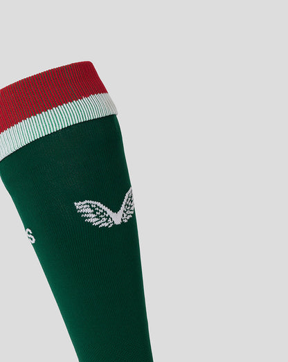 Close-up of the green sock showing a white crest near the cuff and TIGERS lettering.