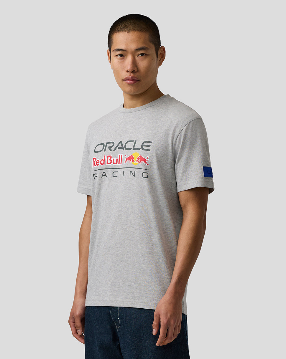 Person wearing a gray t-shirt with Oracle Red Bull Racing logo on a plain background