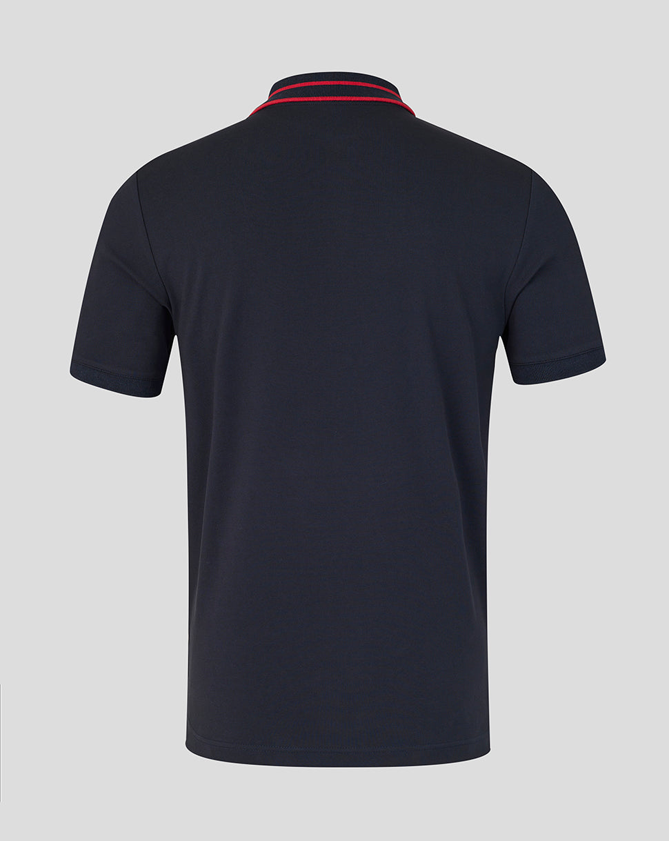 Black polo shirt with red and blue trim on a gray background