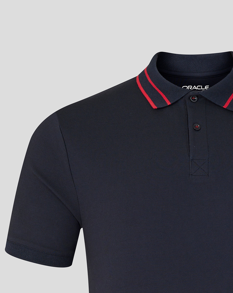 Navy blue polo shirt with red trim on a light gray background