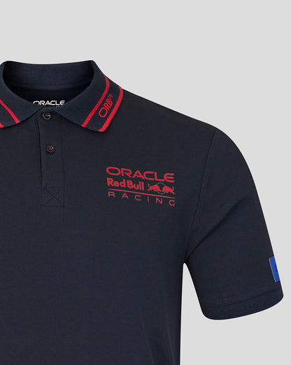 Navy blue polo shirt with Oracle Red Bull Racing logo on a light gray background