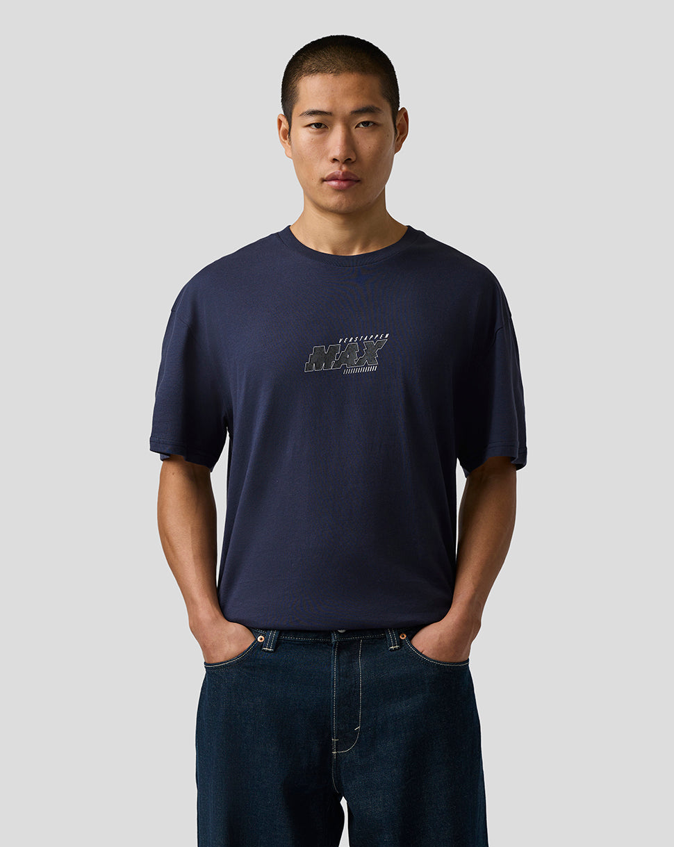 Man wearing a navy blue t-shirt with a logo on a light gray background