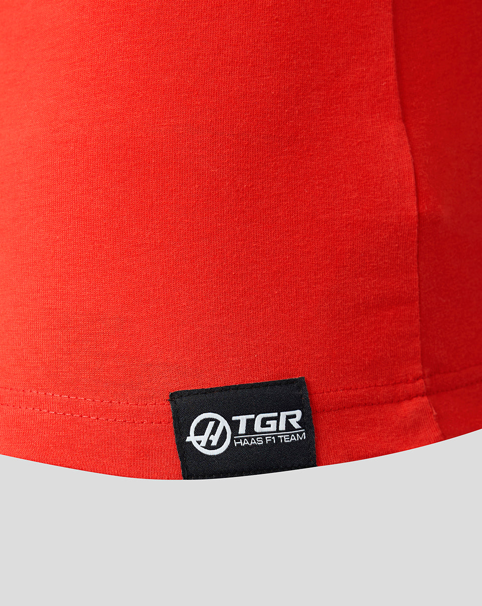 Red fabric with a TGR logo tag on a gray background