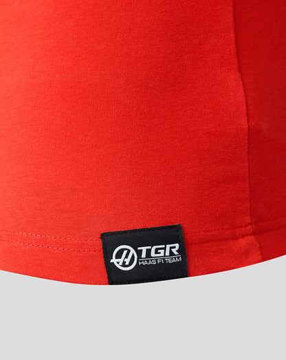 Red fabric with a TGR logo tag on a gray background