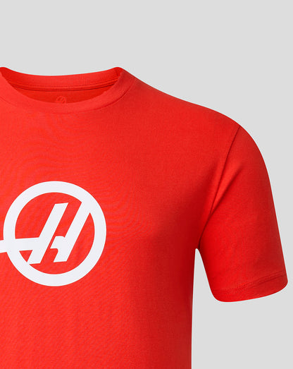 Red t-shirt with a white logo on a gray background