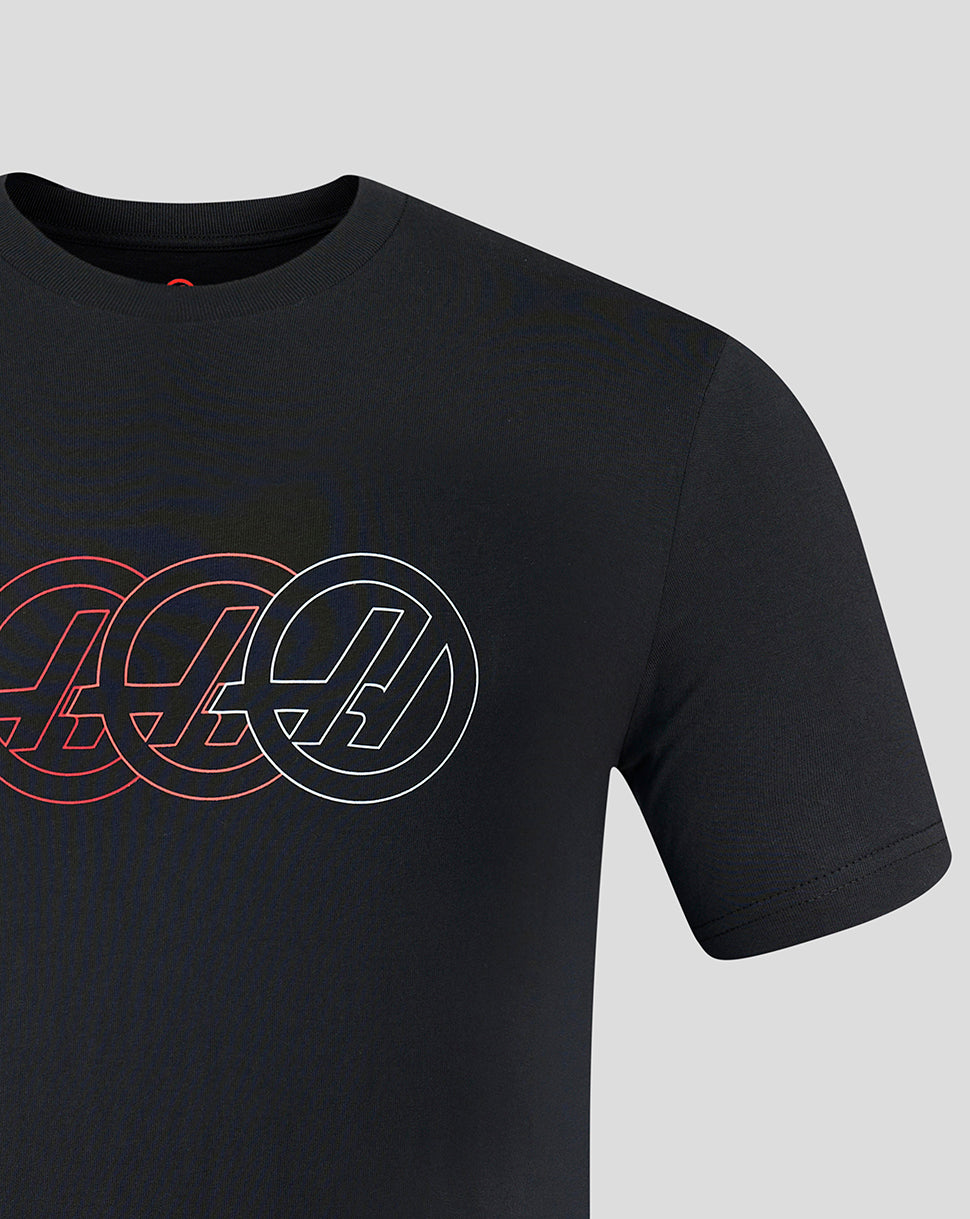 Black t-shirt with circular logo design on a gray background