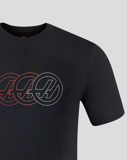 Black t-shirt with circular logo design on a gray background
