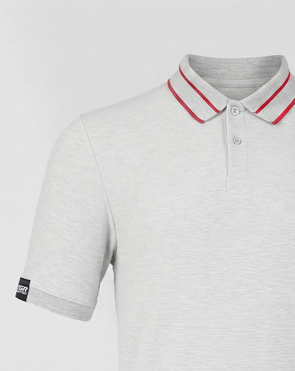 Gray polo shirt with red trim on a light gray background