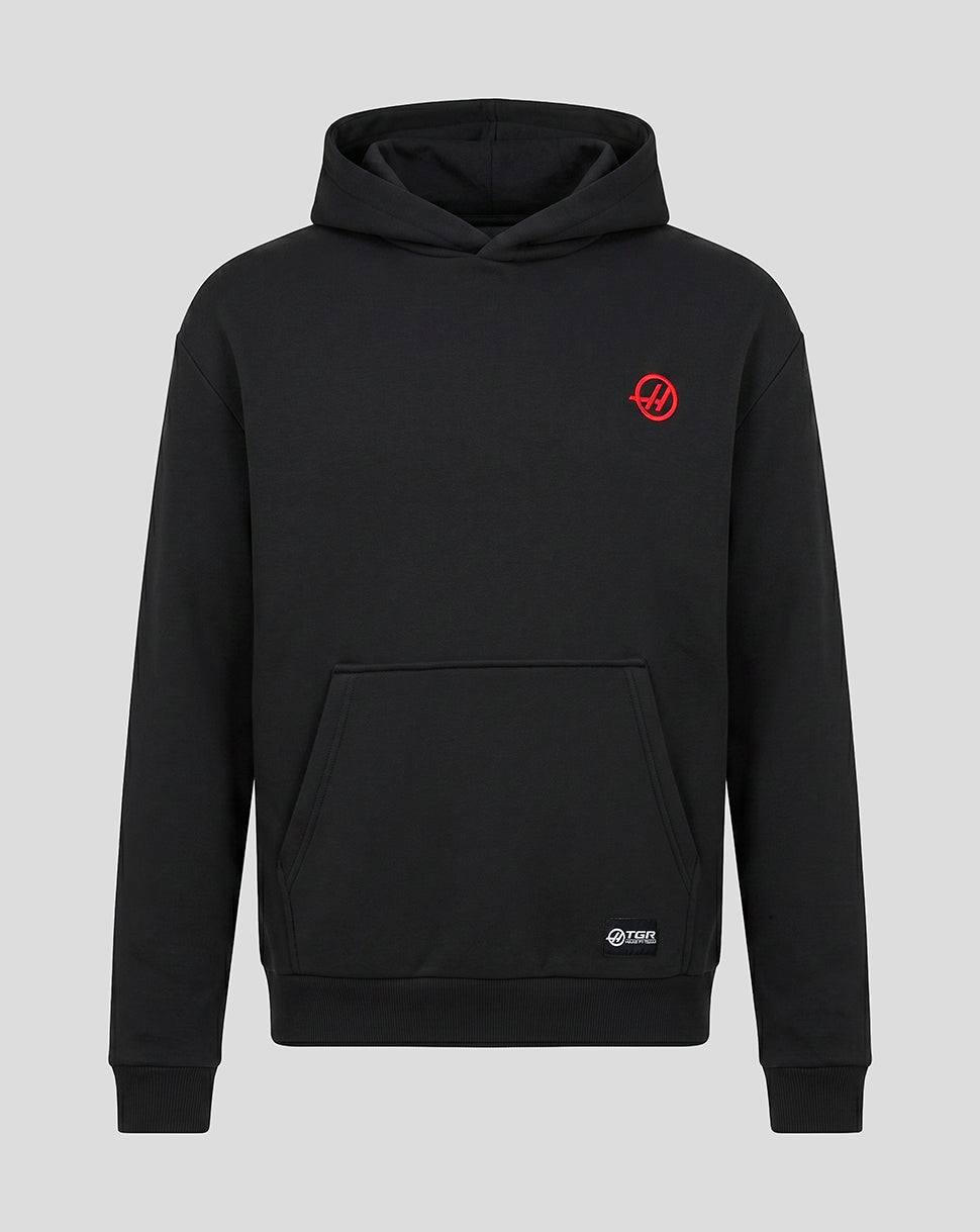 Front view of black Haas pullover hoodie with a small red Haas logo on the left chest and a kangaroo pocket.
