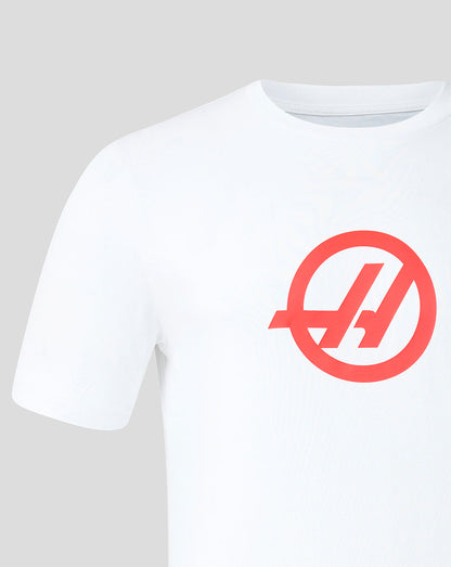 Front view of white Haas Team T shirt with a bold red circular Haas logo on the chest