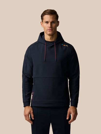 Male model wearing navy Paul Smith Castore England cricket hoodie with red white drawcords and a signature shoulder stripe.