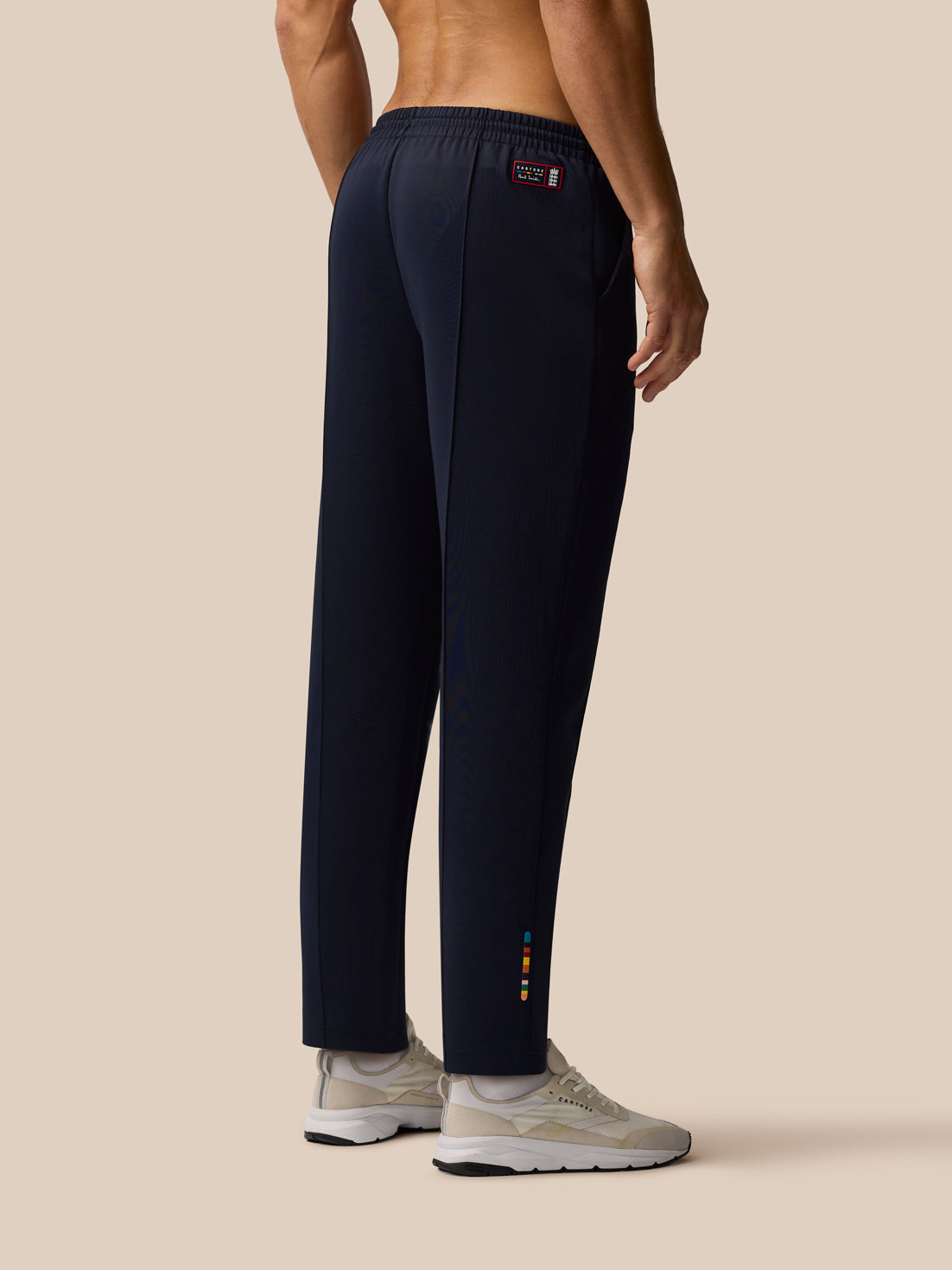 Back view of navy Paul Smith x Castore England Cricket unisex trousers with elastic back waistband and rear patch