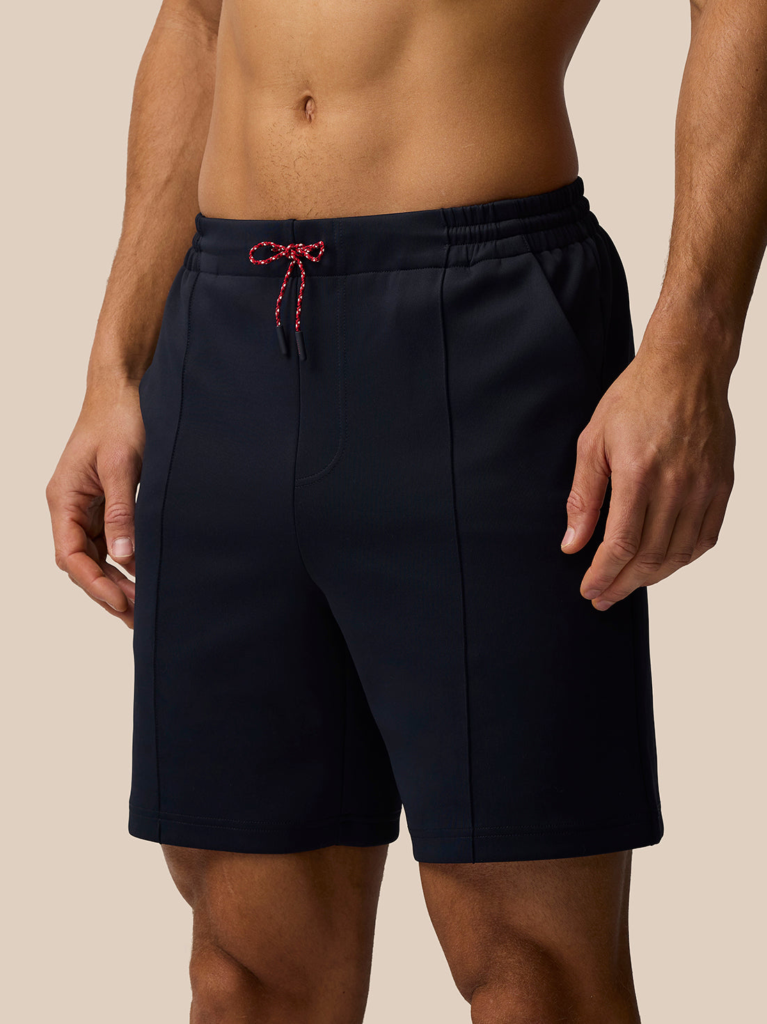 Navy Paul Smith Castore ECB travel shorts with red white drawcords and back ECB patch