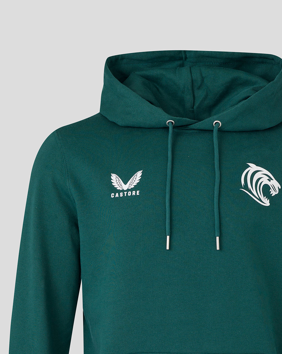 Close up of dark green hoodie showing large white tiger head crest on the chest and Castore branding on the opposite side