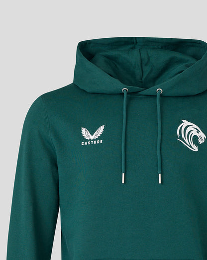 Close up of dark green hoodie showing large white tiger head crest on the chest and Castore branding on the opposite side