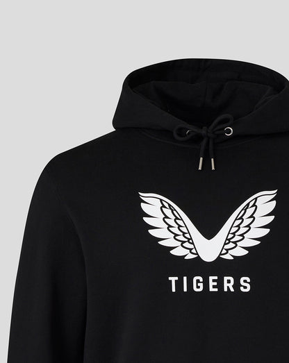 Upper chest detail of the black hoodie with a large white wing emblem.