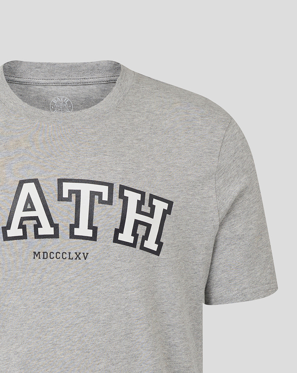 Partial front view of heather grey Bath Rugby unisex varsity tee with large Bath lettering across the chest