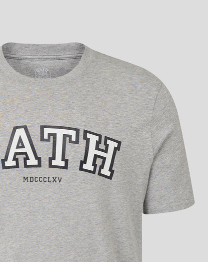 Partial front view of heather grey Bath Rugby unisex varsity tee with large Bath lettering across the chest