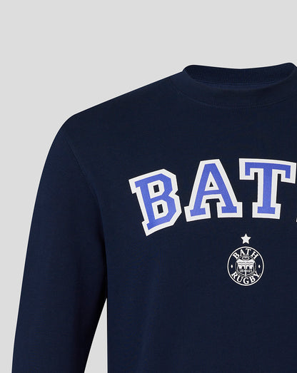 Detail view of navy Bath Rugby varsity crew sweatshirt showing large BATH lettering and chest emblem