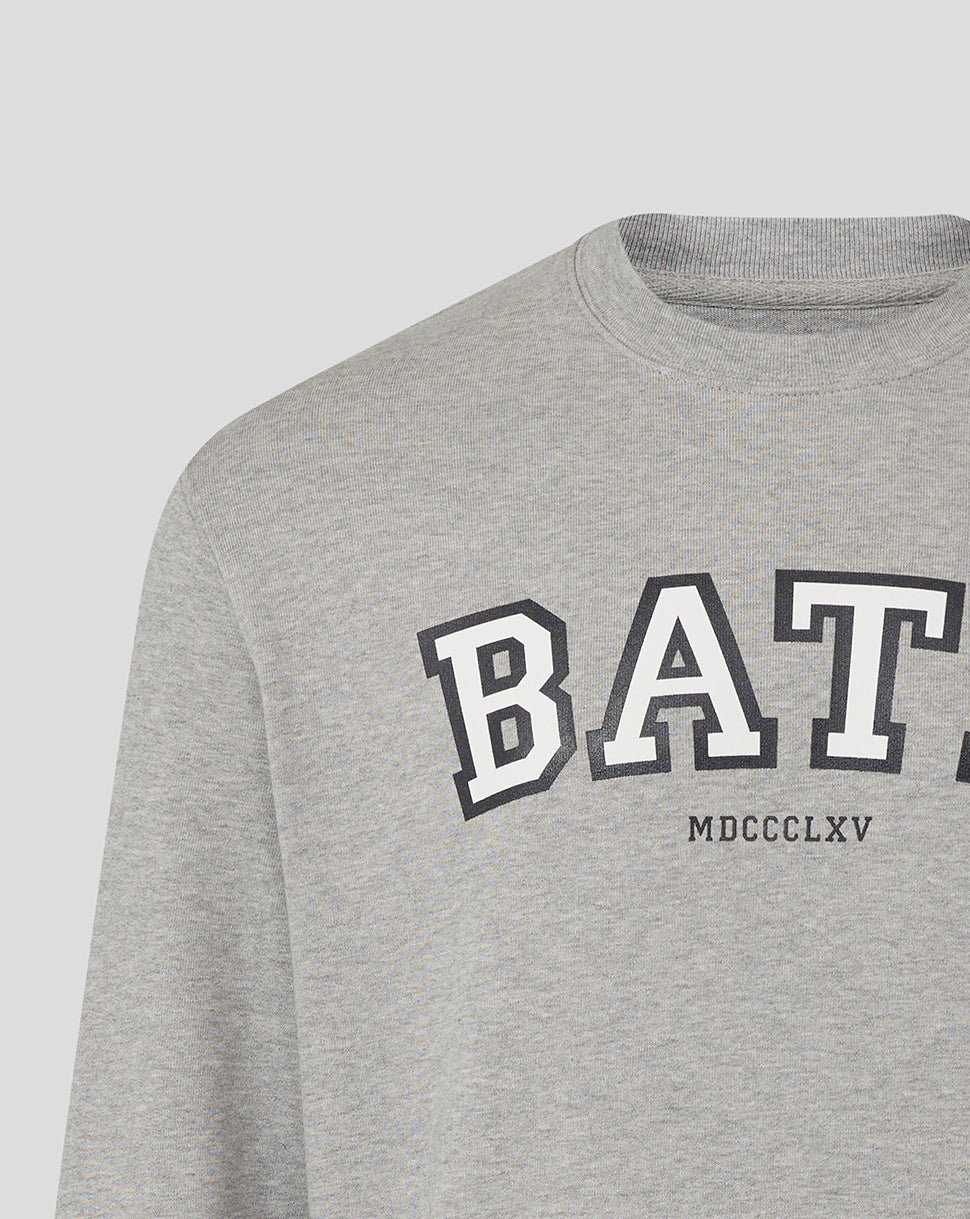Close-up of heather grey Bath Rugby varsity crew sweatshirt showing large BATH lettering across the chest.