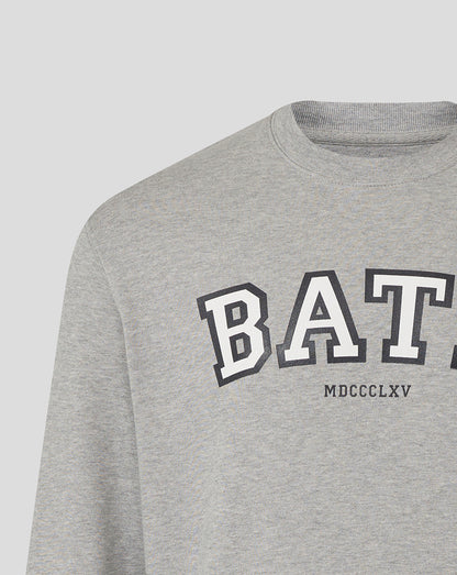 Close-up of heather grey Bath Rugby varsity crew sweatshirt showing large BATH lettering across the chest.